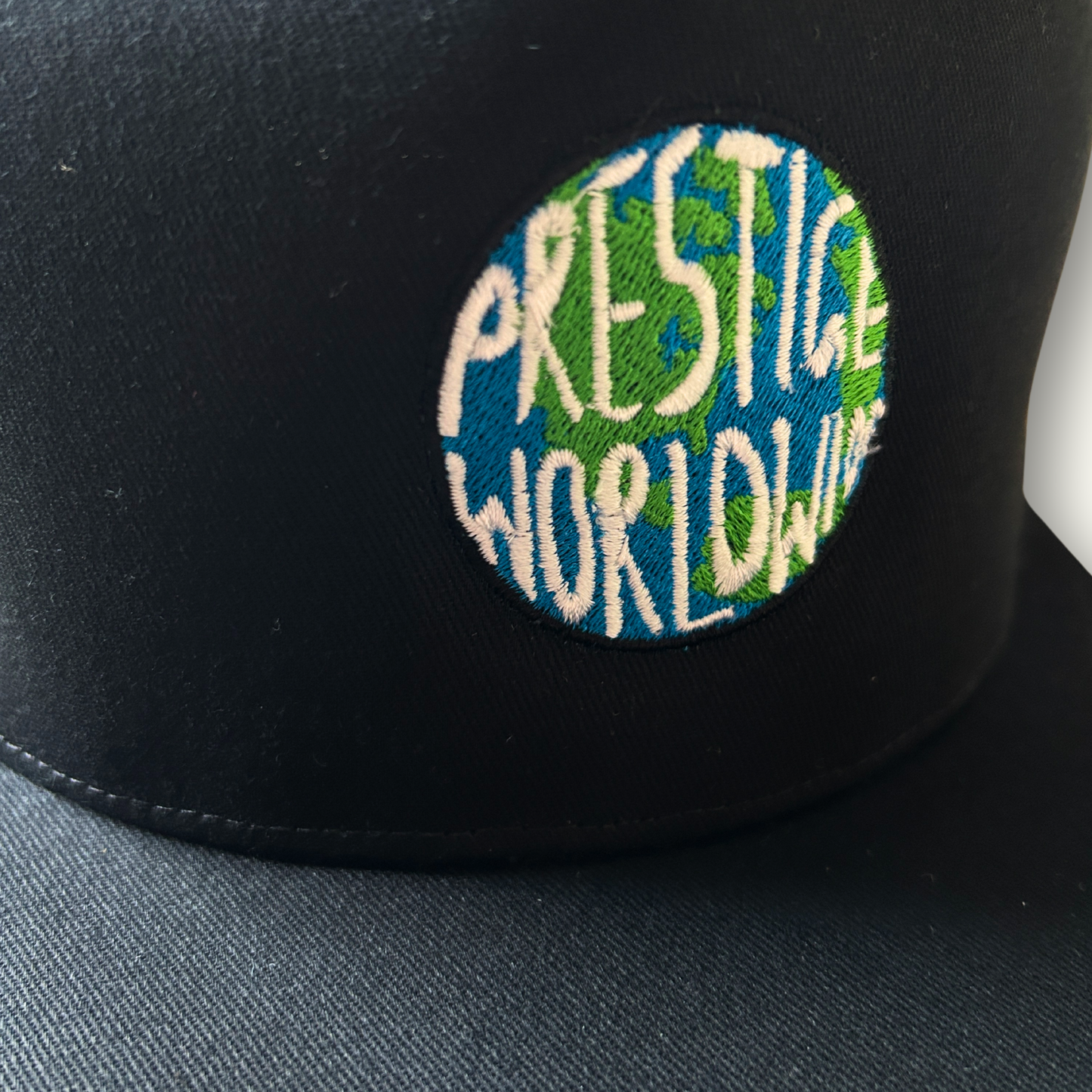 Prestige Worldwide Embroidered Snapback Cap